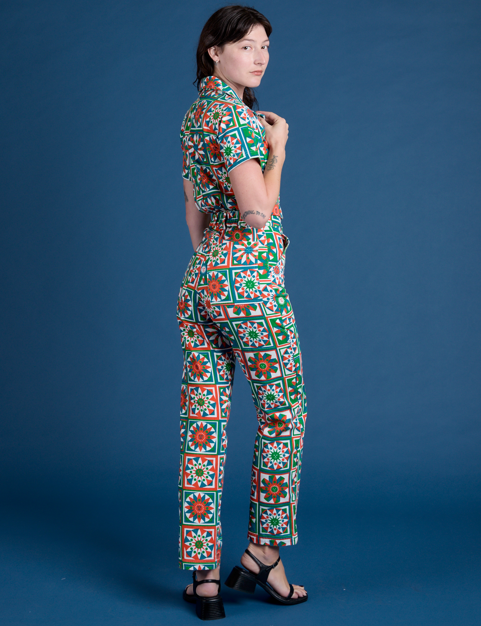 Angled back view of Quilt Print Jumpsuit on Alex