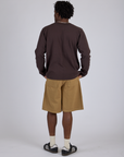 Back view of Longline Work Shorts in Desert Brown and espresso brown Long Sleeve Burly Tee on Isaac