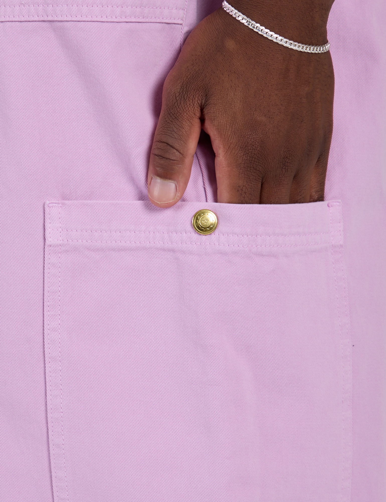 Close up of Isaac's hand in the side pant leg pocket of Drop Pocket Cargo Pants in Lilac Purple
