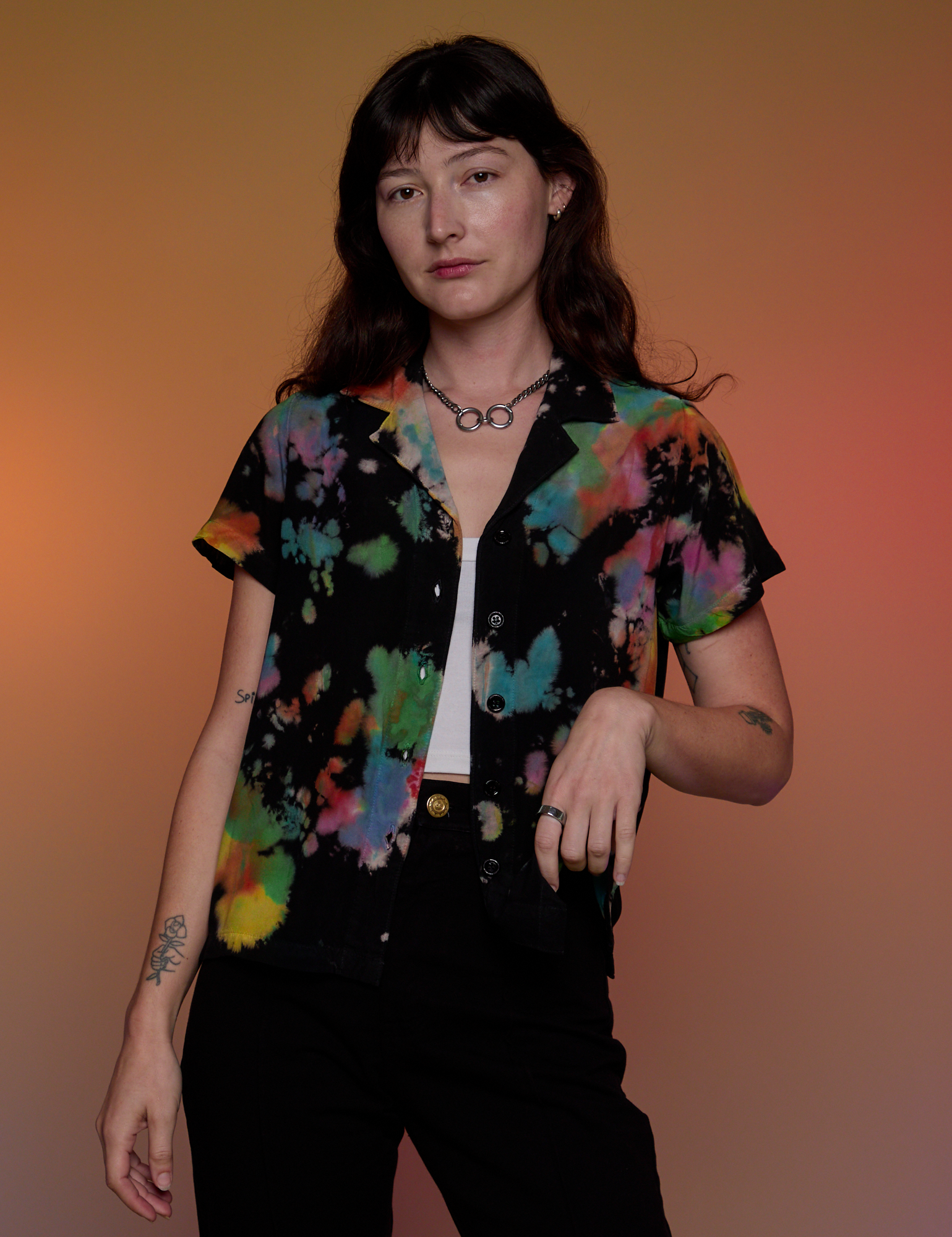 Alex is 5’8” and wearing P Pantry Button-Up in Rainbow Magic Waters