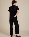 Short Sleeve Jumpsuit in Basic Black back view on Quinn