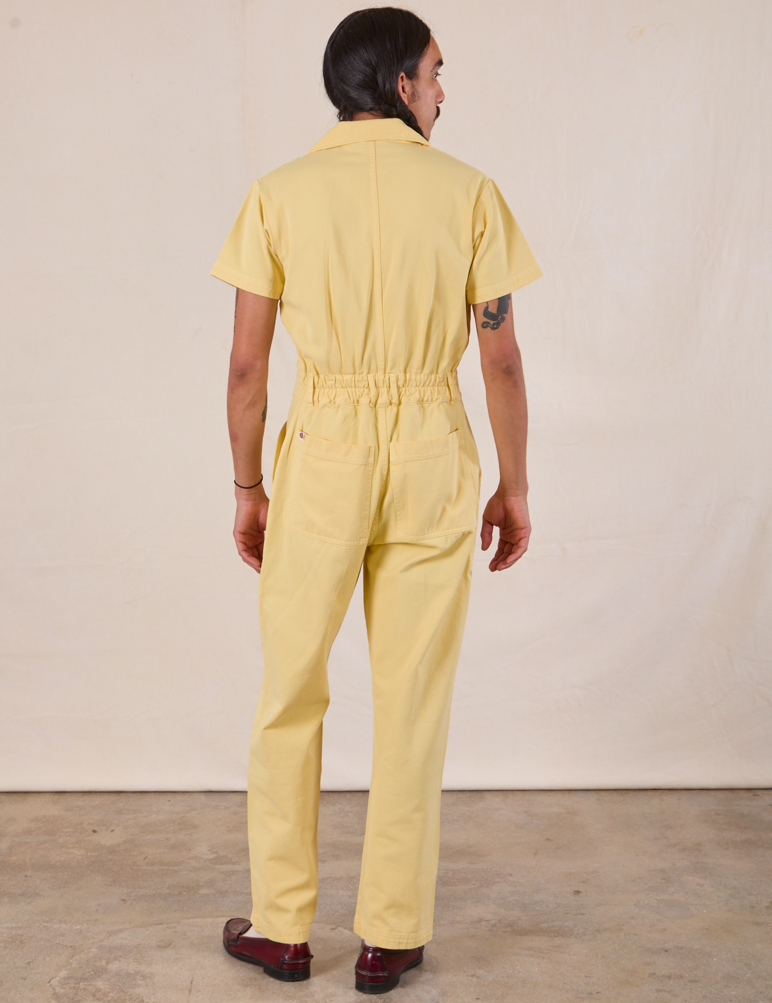 Short Sleeve Jumpsuit in Butter Yellow back view on Anthony