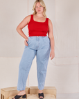 Lish is wearing Square Neck Tank in Mustang Red and light wash Trouser Jeans