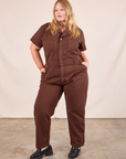 Juliet is 5'7" and wearing 1XL Short Sleeve Jumpsuit in Fudgesicle Brown