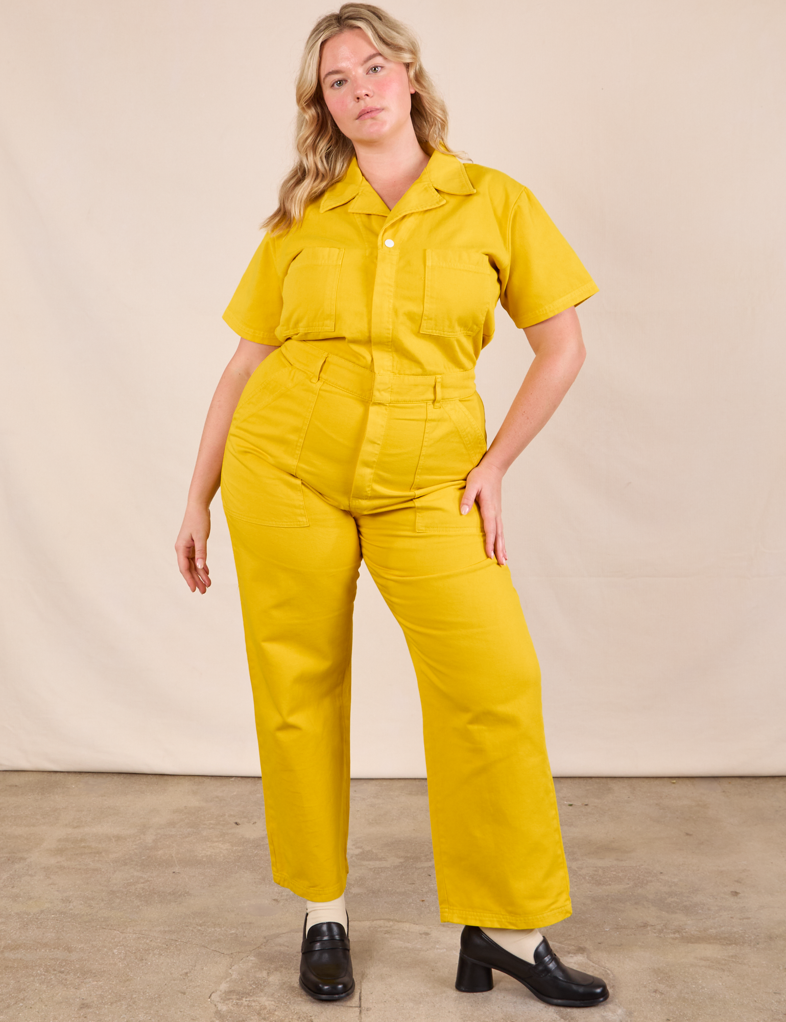 Lish is 5&#39;8&quot; and wearing L Short Sleeve Jumpsuit in Golden Yellow