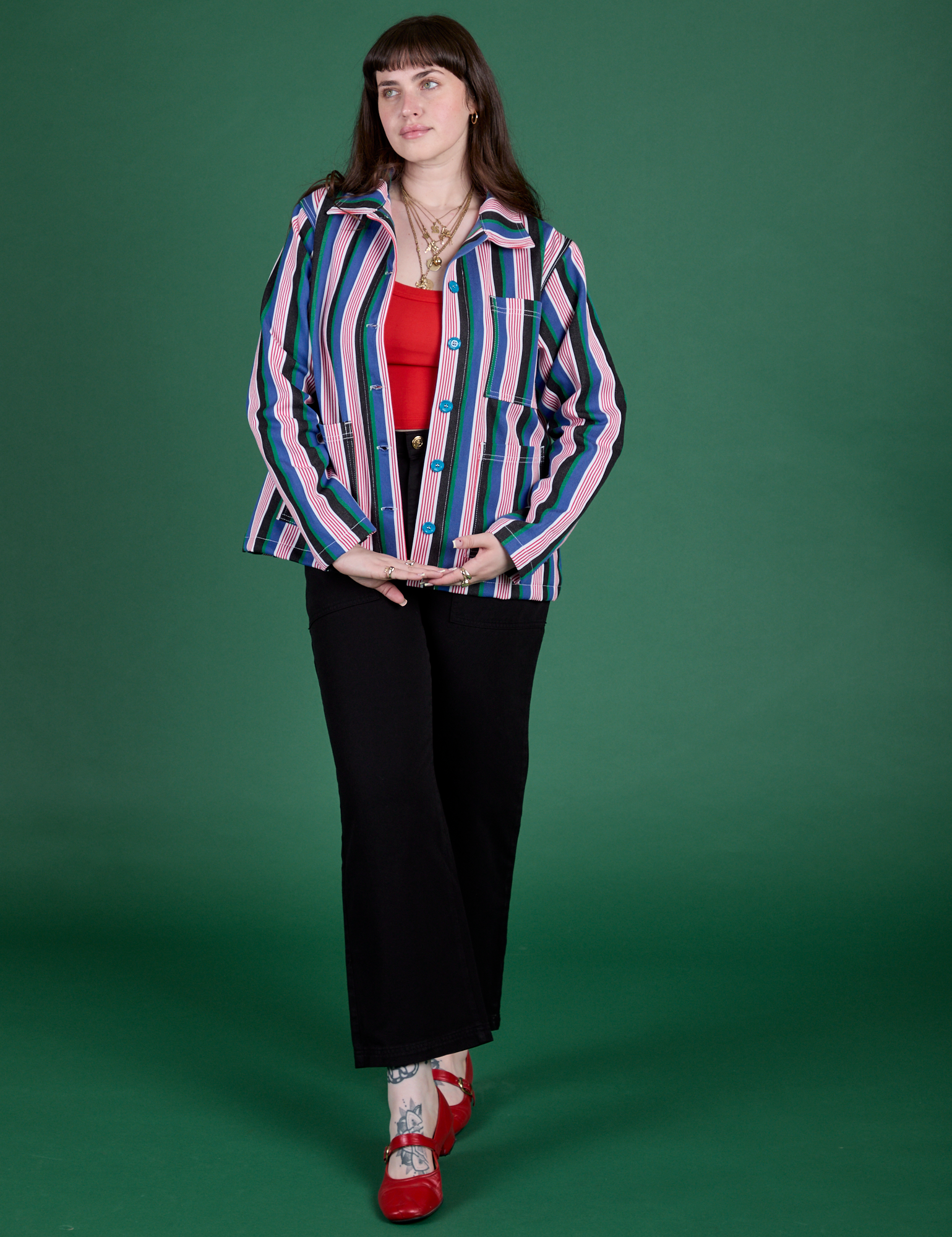 Sydney is wearing Stripe Work Jacket in Pacific Stripe paired with black Work Pants