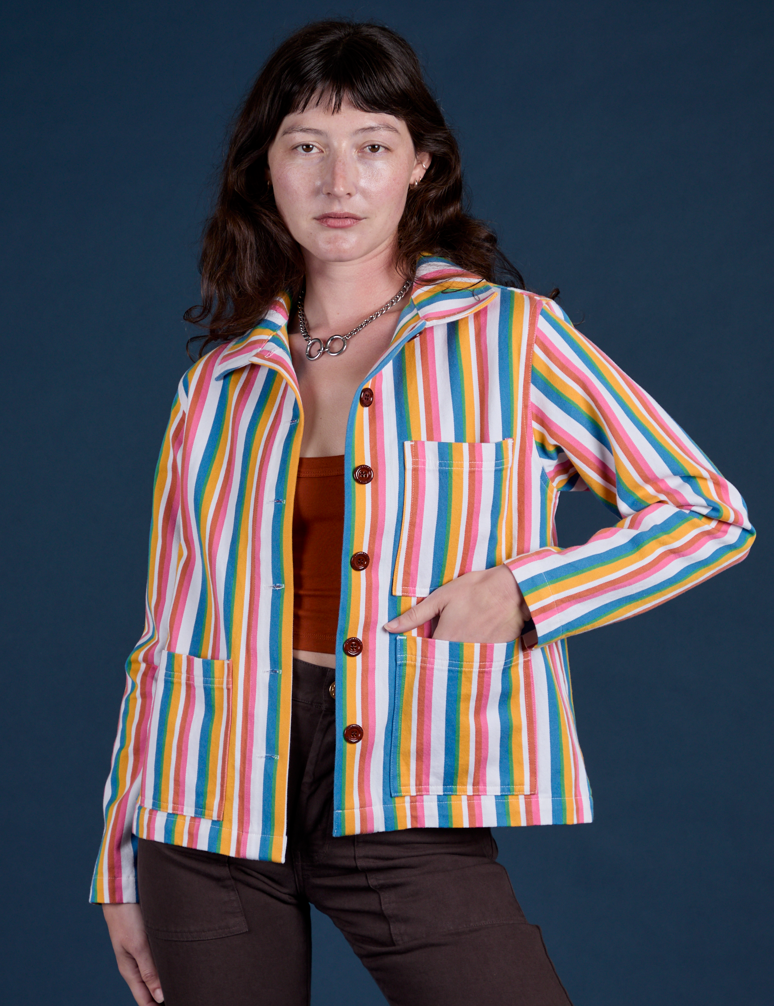 Alex is 5’8” and wearing P Stripe Work Jacket in Rainbow Stripe