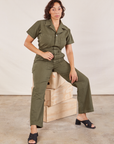 Tiara is wearing Short Sleeve Jumpsuit in Surplus Green