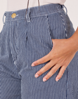 Front pocket close up of Denim Trouser Jeans in Railroad Stripe. Gabi has her hand in the pocket.