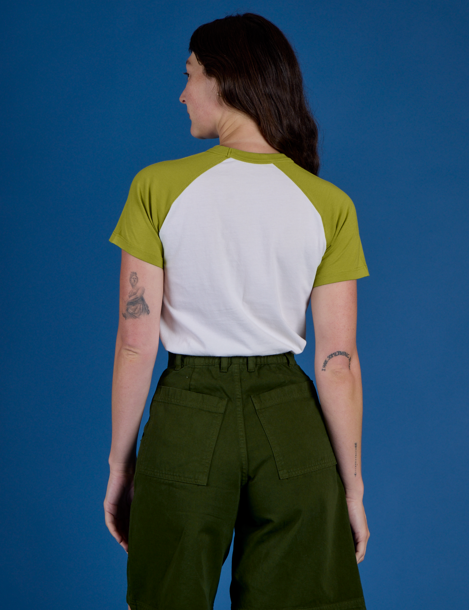 Back view of Produce Raglan Tee in Snap Peas on Alex