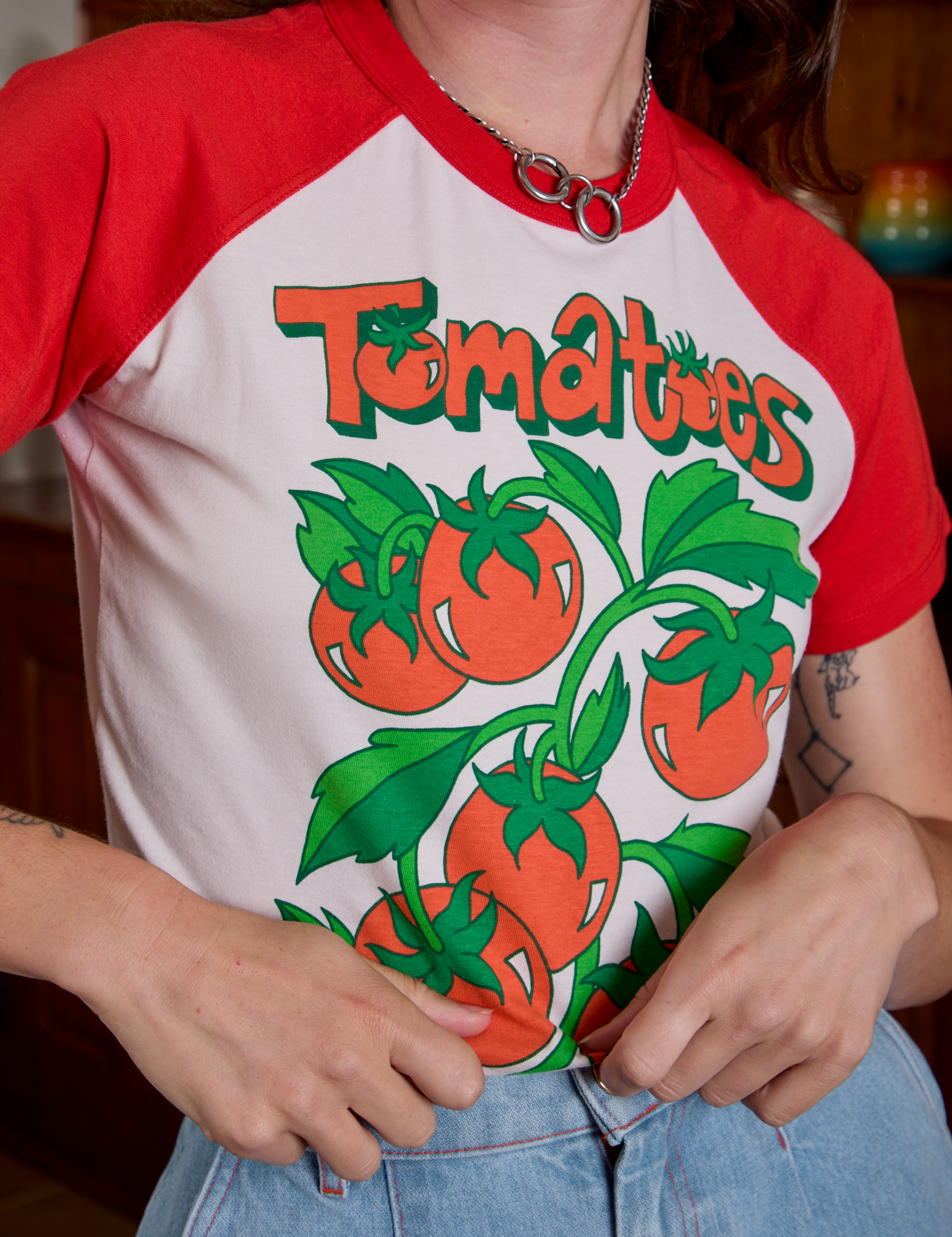 Short Sleeve Raglan Tee in Tomatoes front close up on Alex