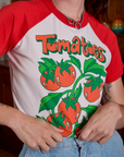 Short Sleeve Raglan Tee in Tomatoes front close up on Alex