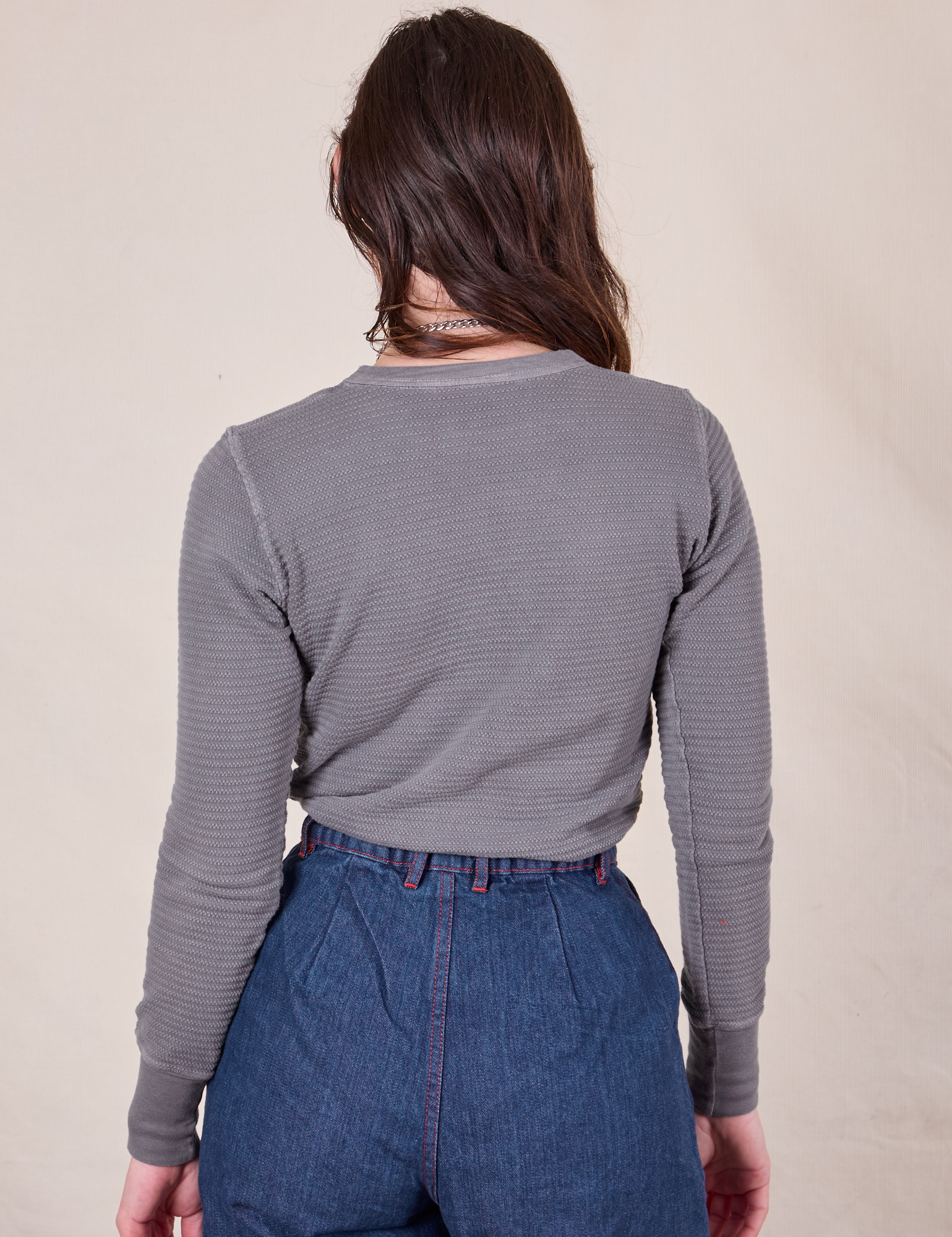 Back view of Honeycomb Thermal in Washed Grey on Alex