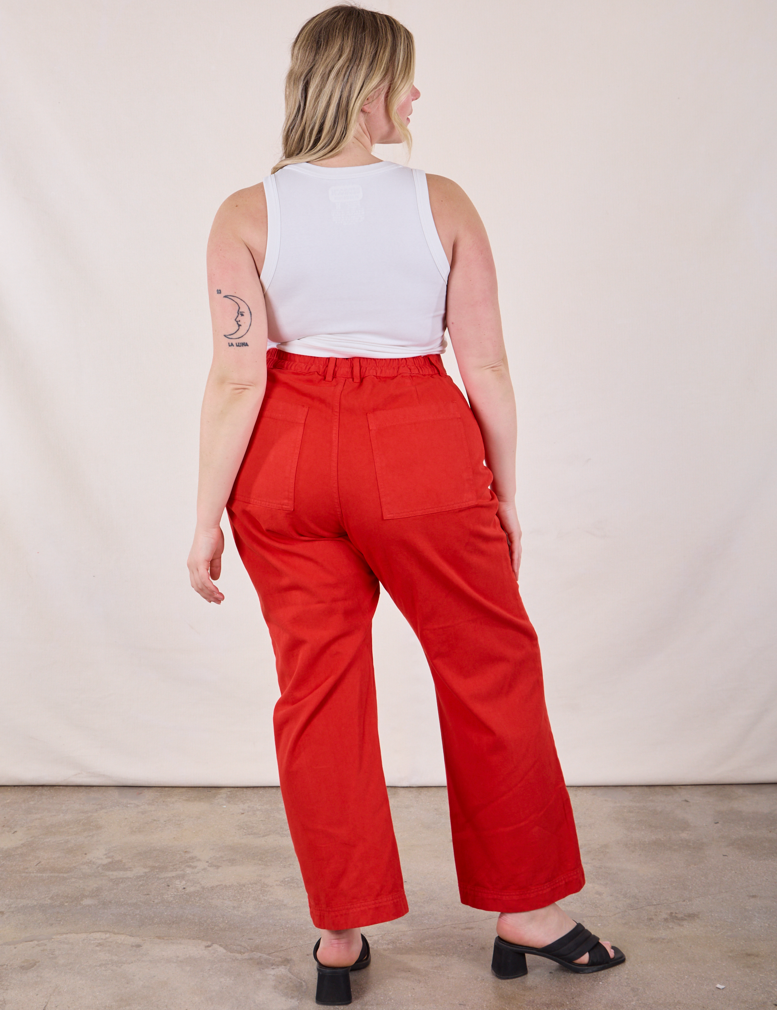 Back view of Western Pants in Mustang Red and Cropped Tank in Vintage Tee Off-White on Lish