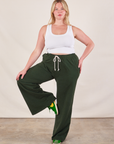 Lish is wearing Wide Leg Sweat Pants in Swamp Green and Cropped Tank in vintage tee off-white