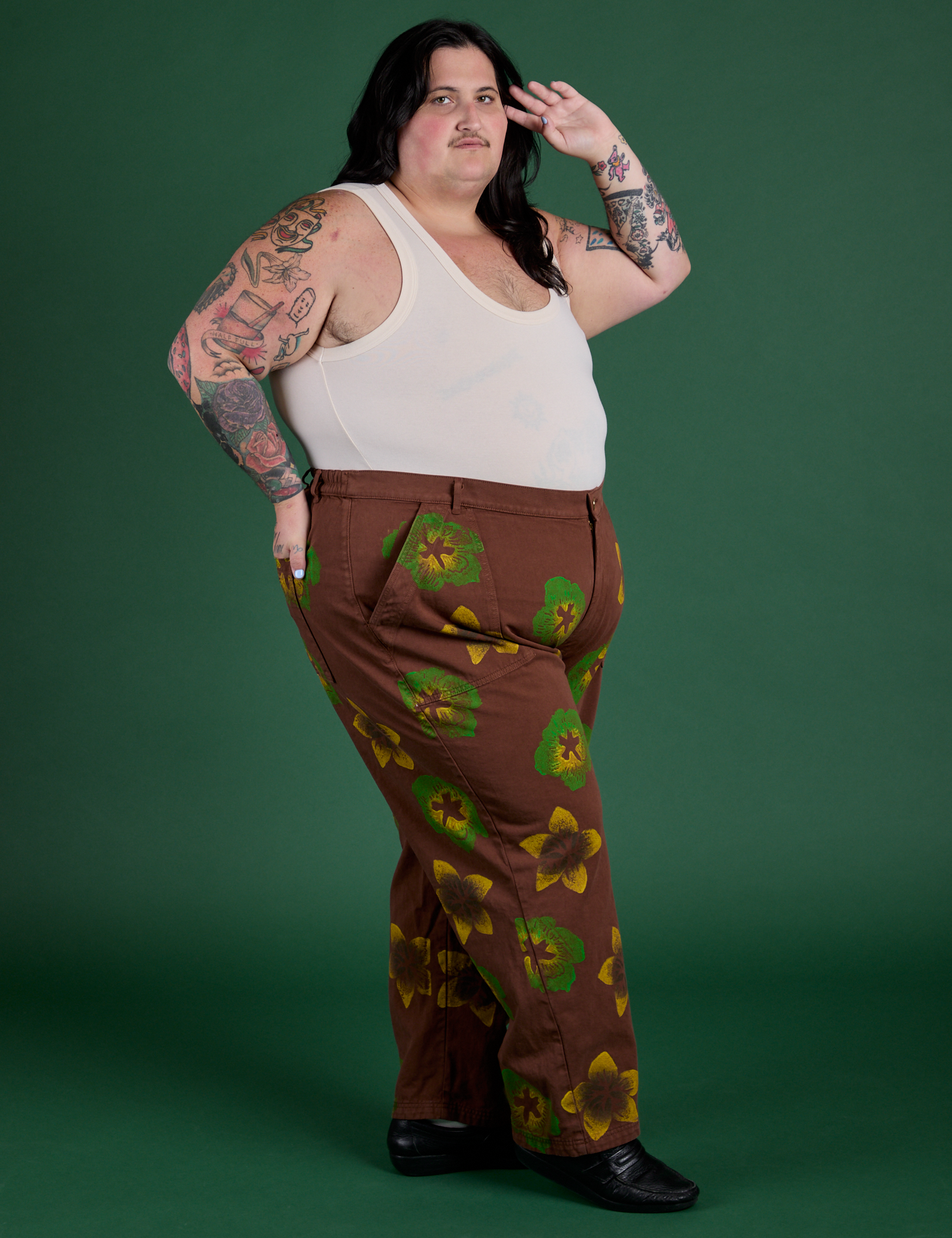 Side view of Floral Painted Work Pants in Brown and Tank Top in Vintage Tee Off-White on Sam