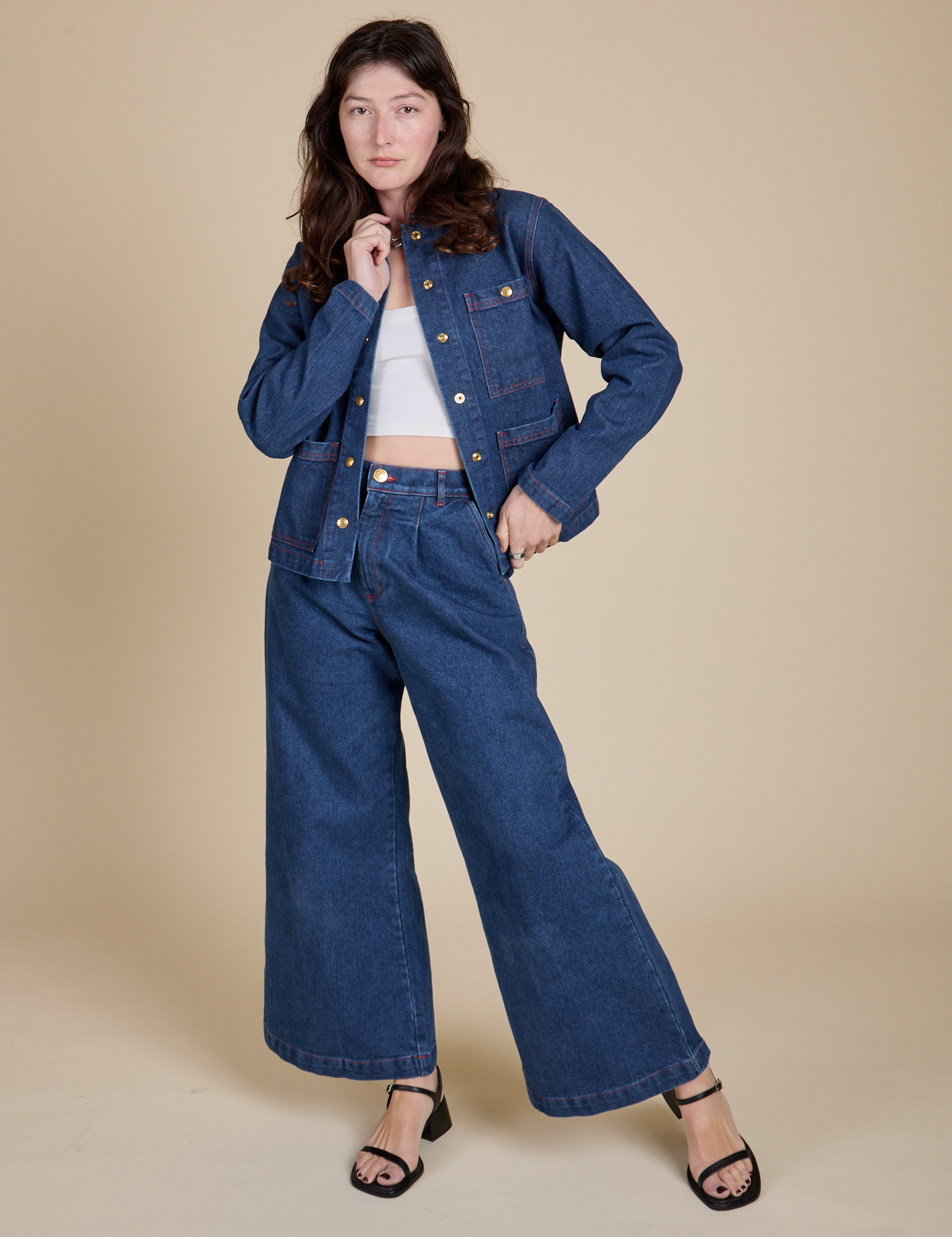 Alex is wearing Indigo Denim Work Jacket in Dark Wash and dark wash Indigo Wide Leg Trousers