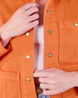 Denim Work Jacket in Construction Orange front close up on Alex