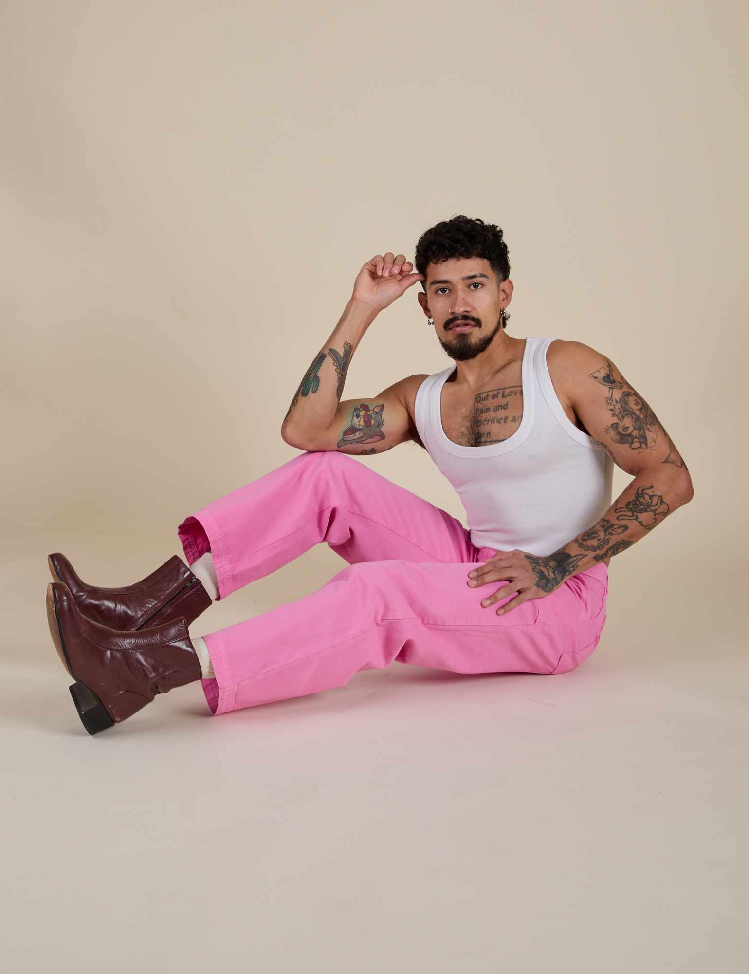 Jesse is wearing Work Pants in Bubblegum Pink and Cropped Tank in Vintage Tee White