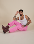 Jesse is wearing Work Pants in Bubblegum Pink and Cropped Tank in Vintage Tee White
