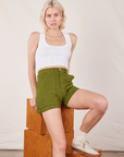 Madeline is wearing Classic Work Shorts in Summer Olive and a Cropped Tank Top in vintage tee off-white