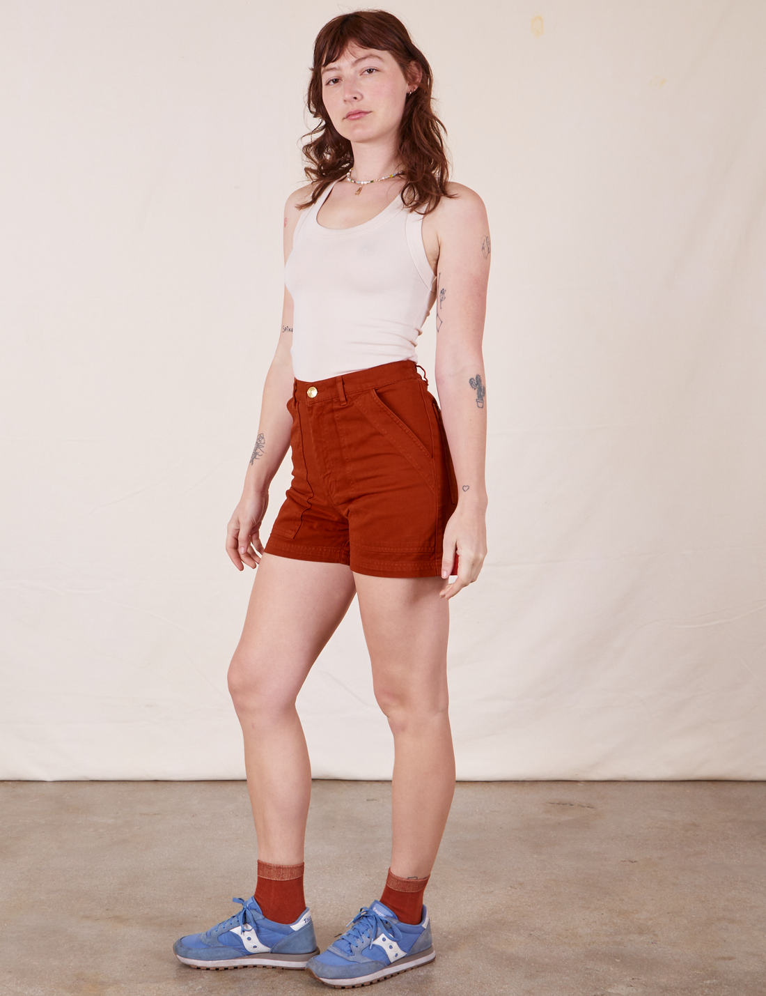 Angled view of Classic Work Shorts in Paprika and vintage off-white Tank Top