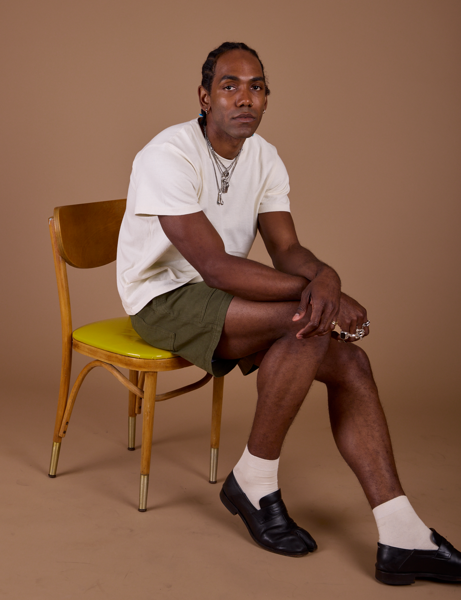 Jerrod is wearing Classic Work Shorts in Surplus Green and Organic Vintage Tee in Vintage Off White