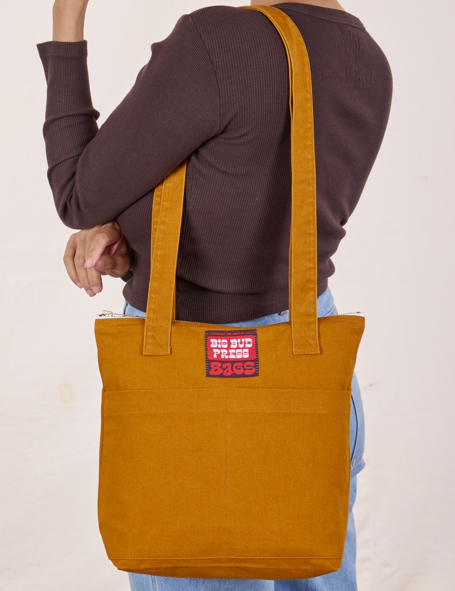 Over-Shoulder Zip Mini Tote in Spicy Mustard worn on shoulder