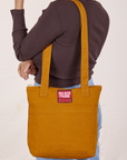 Over-Shoulder Zip Mini Tote in Spicy Mustard worn on shoulder