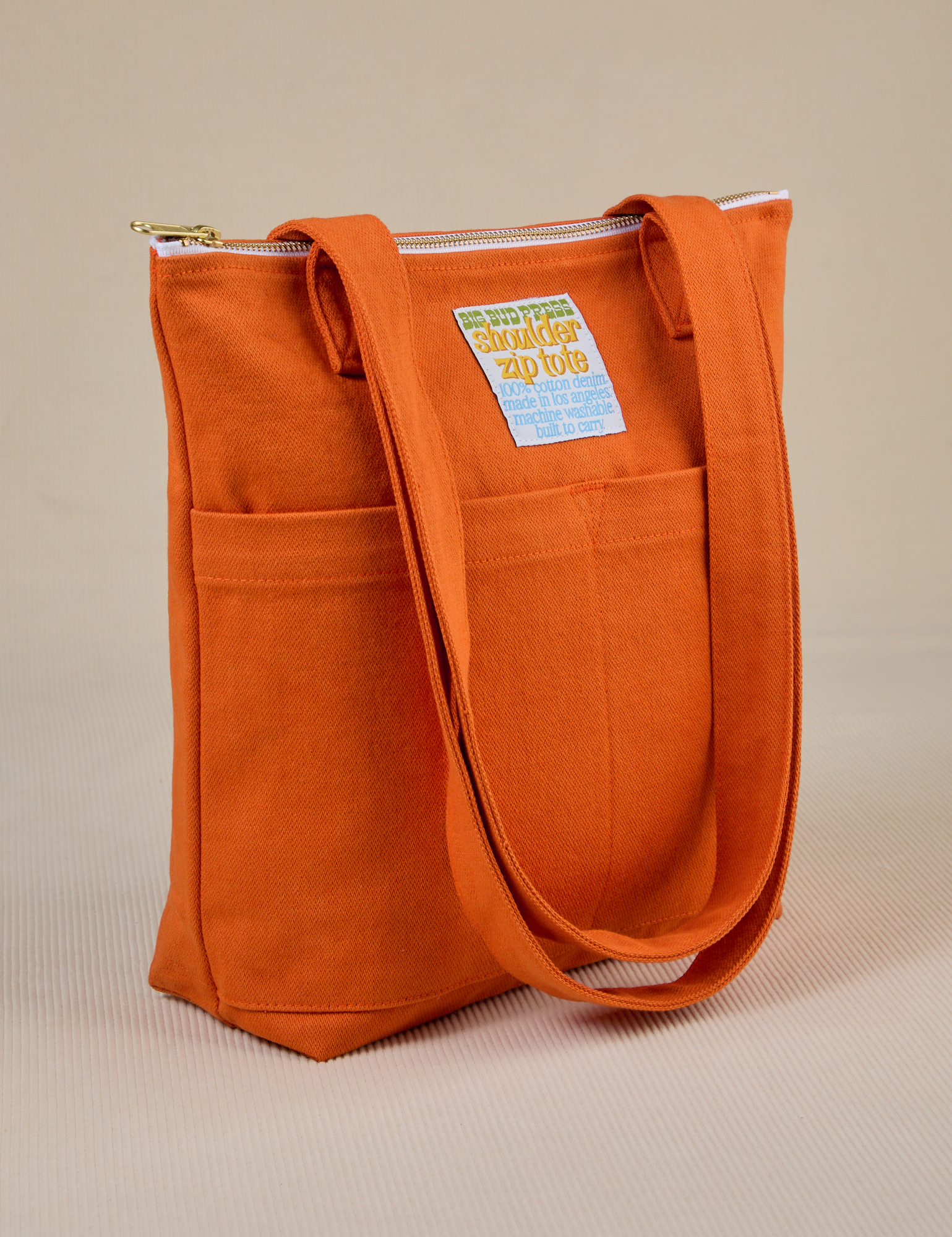 Angled view of Over-Shoulder Zip Mini Tote in Burnt Orange