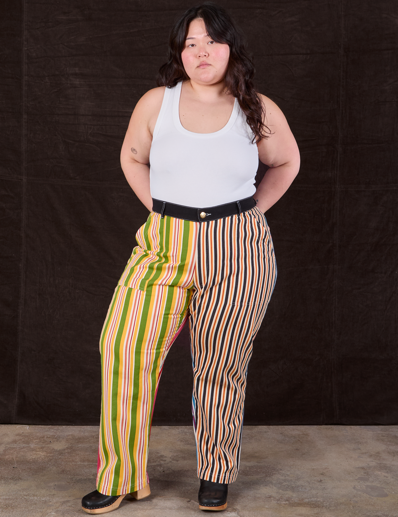 Ashley is wearing Mixed Stripe Work Pants and a Tank Top in vintage tee off-white