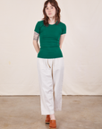 Hana is wearing Baby Tee in Hunter Green and vintage off-white Petite Heavy Weight Trousers