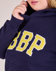 Collegiate Hoodie in Navy Blue embroidered logo close up