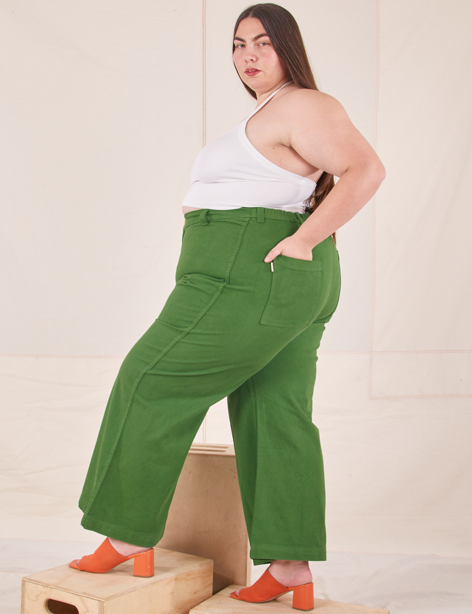 Side view of Bell Bottoms in Lawn Green and vintage off-white Halter Top on Marielena