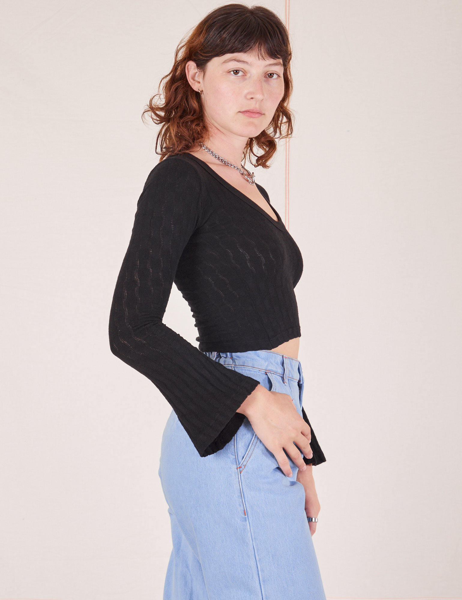Side view of Bell Sleeve Top in Basic Black worn by Alex
