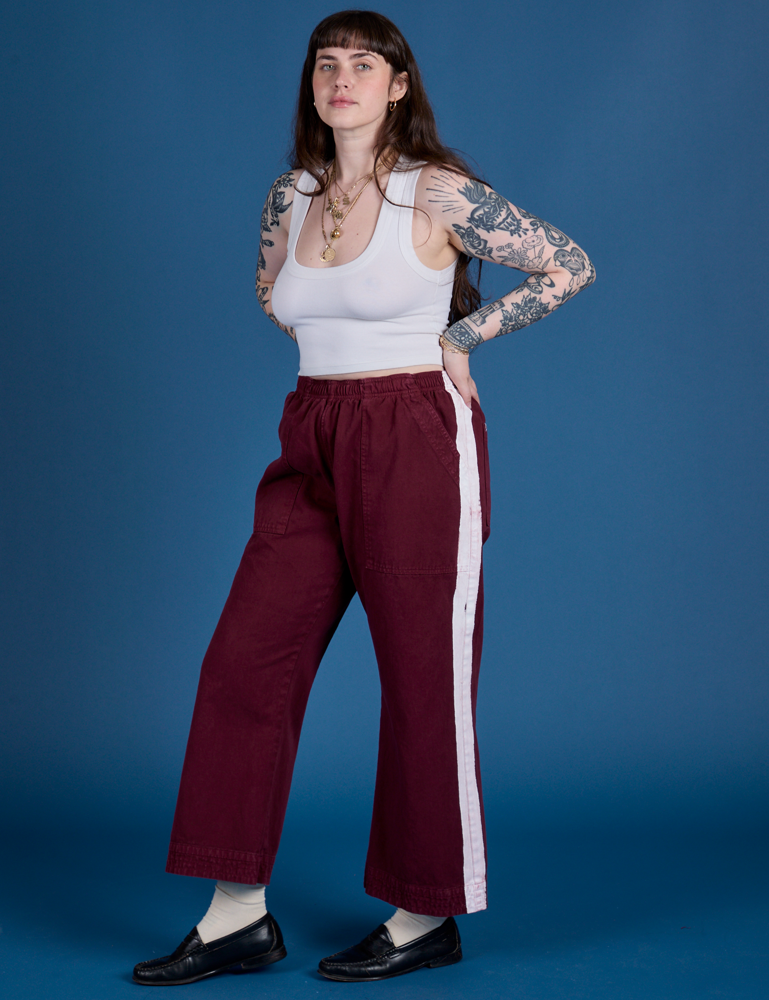 Angled front view of Painted Action Pants in Red Wine and Cropped Tank in Vintage Tee White on Sydney