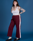 Angled front view of Painted Action Pants in Red Wine and Cropped Tank in Vintage Tee White on Sydney