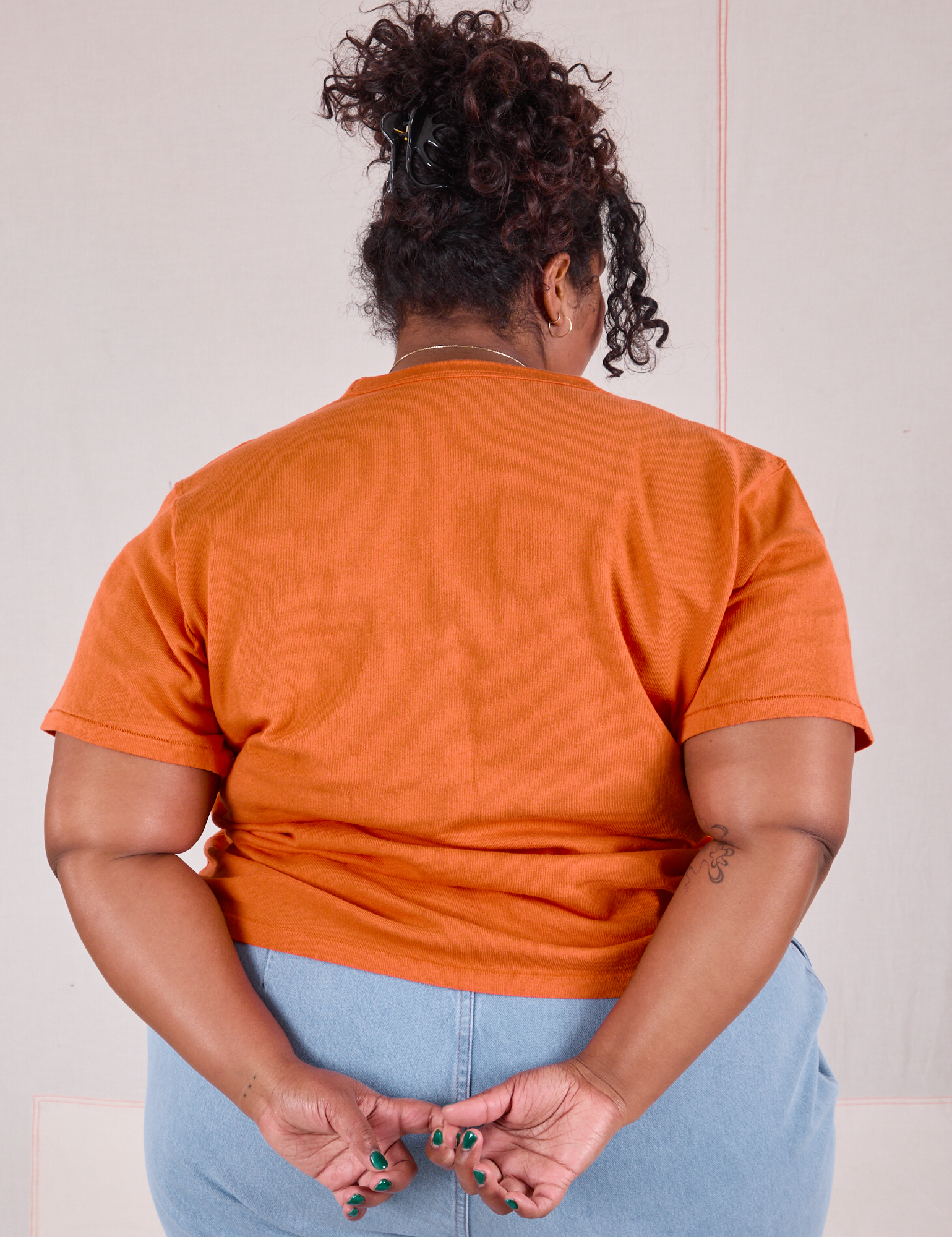 Burly Tee in Construction Orange back view on Morgan