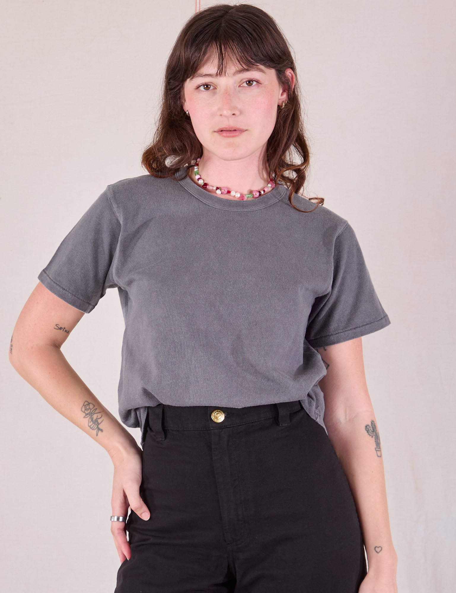 Burly Tee in Washed Grey tucked into black Work Pants on Alex