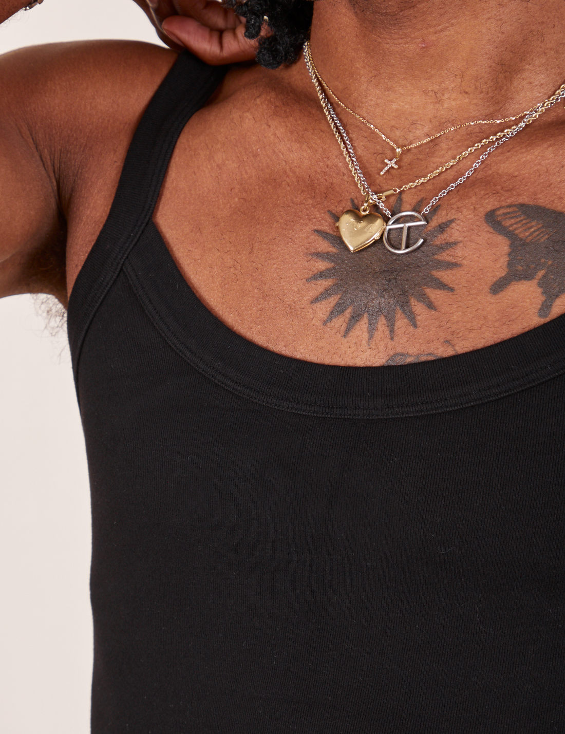 Front close up of Cropped Cami in Basic Black worn by Jerrod
