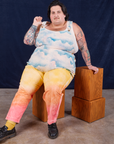 Airbrush Overalls worn by Sam sitting on a wooden box