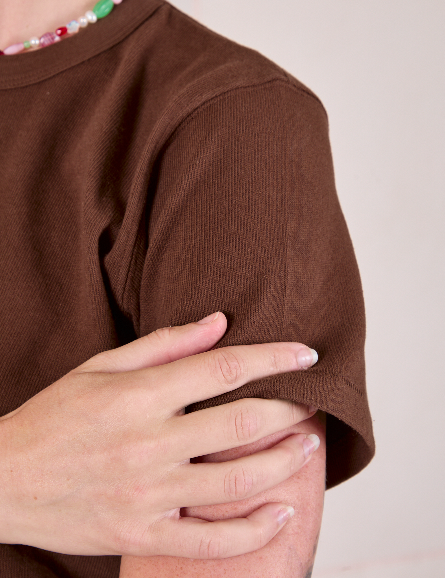 Cropped Burly Tee in Fudgesicle Brown sleeve close up