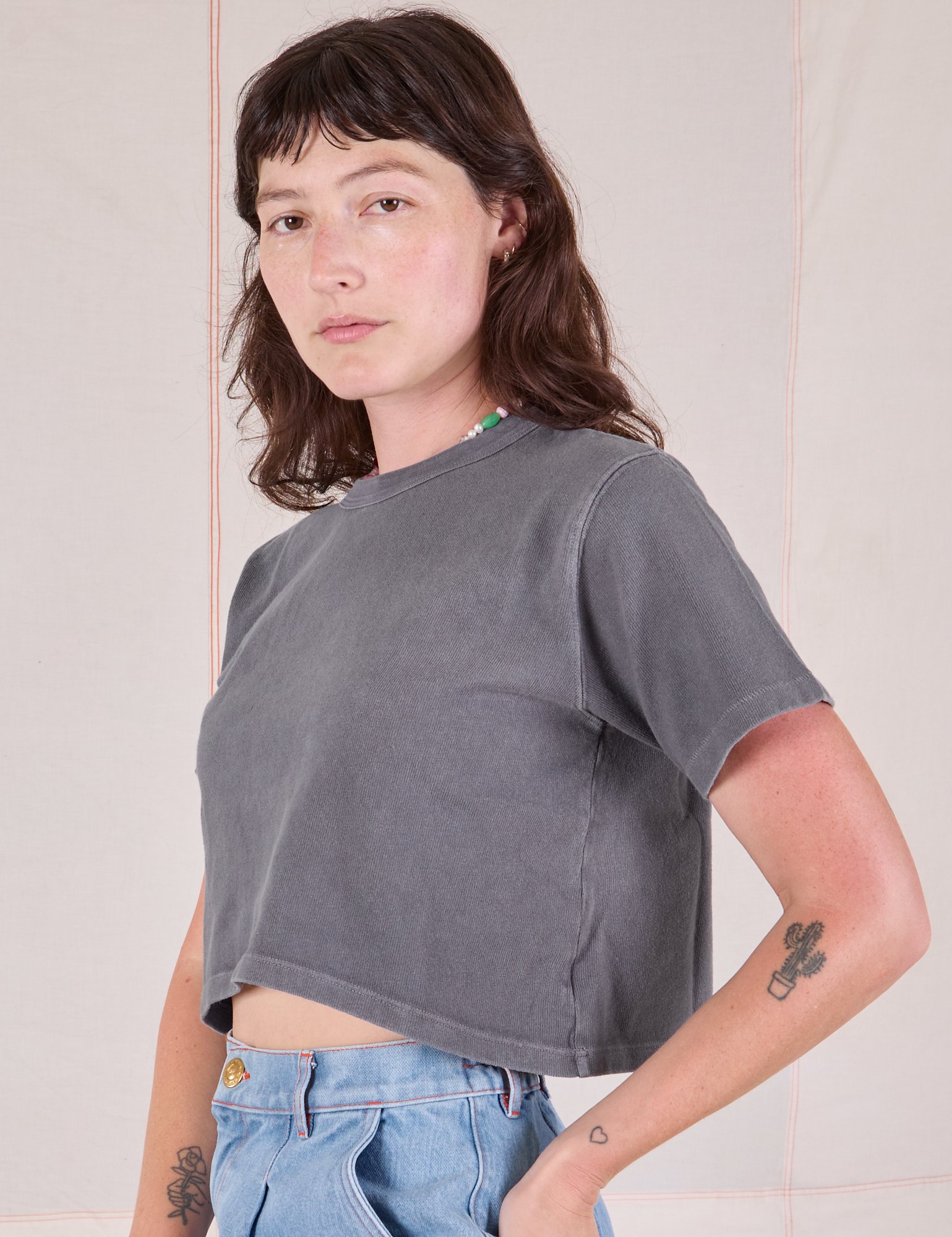 Cropped Burly Tee in Washed Grey angled front view on Alex