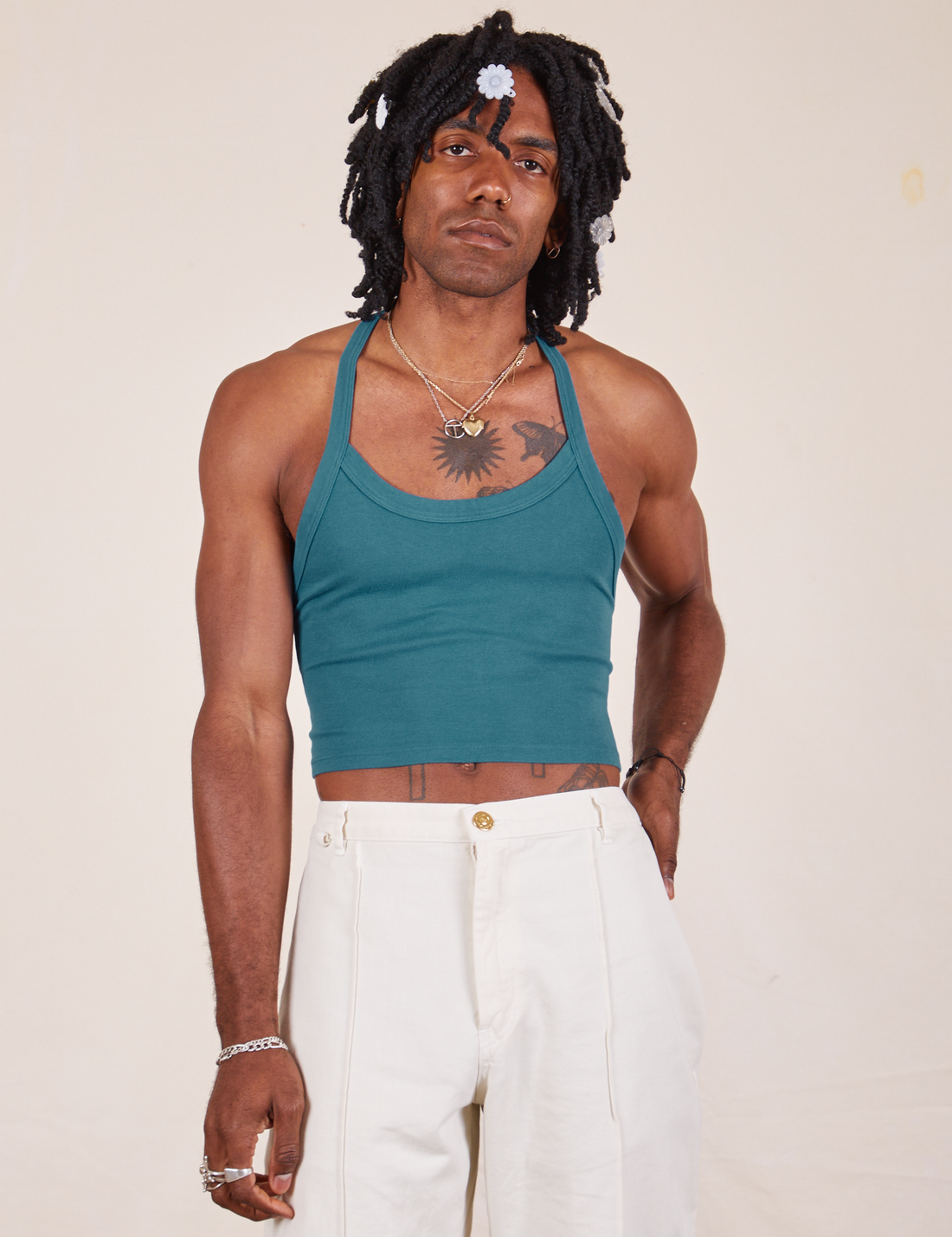 Jerrod is 6'3" and wearing XS Halter Top in Marine Blue