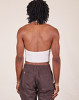 Back view of Halter Top in Vintage Off-White and espresso brown Western Pants worn by Jerrod