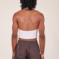 Back view of Halter Top in Vintage Off-White and espresso brown Western Pants worn by Jerrod