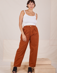 Tiara is 5'4" and wearing S Heavyweight Trousers in Burnt Terracotta paired with vintage off-white Cropped Cami
