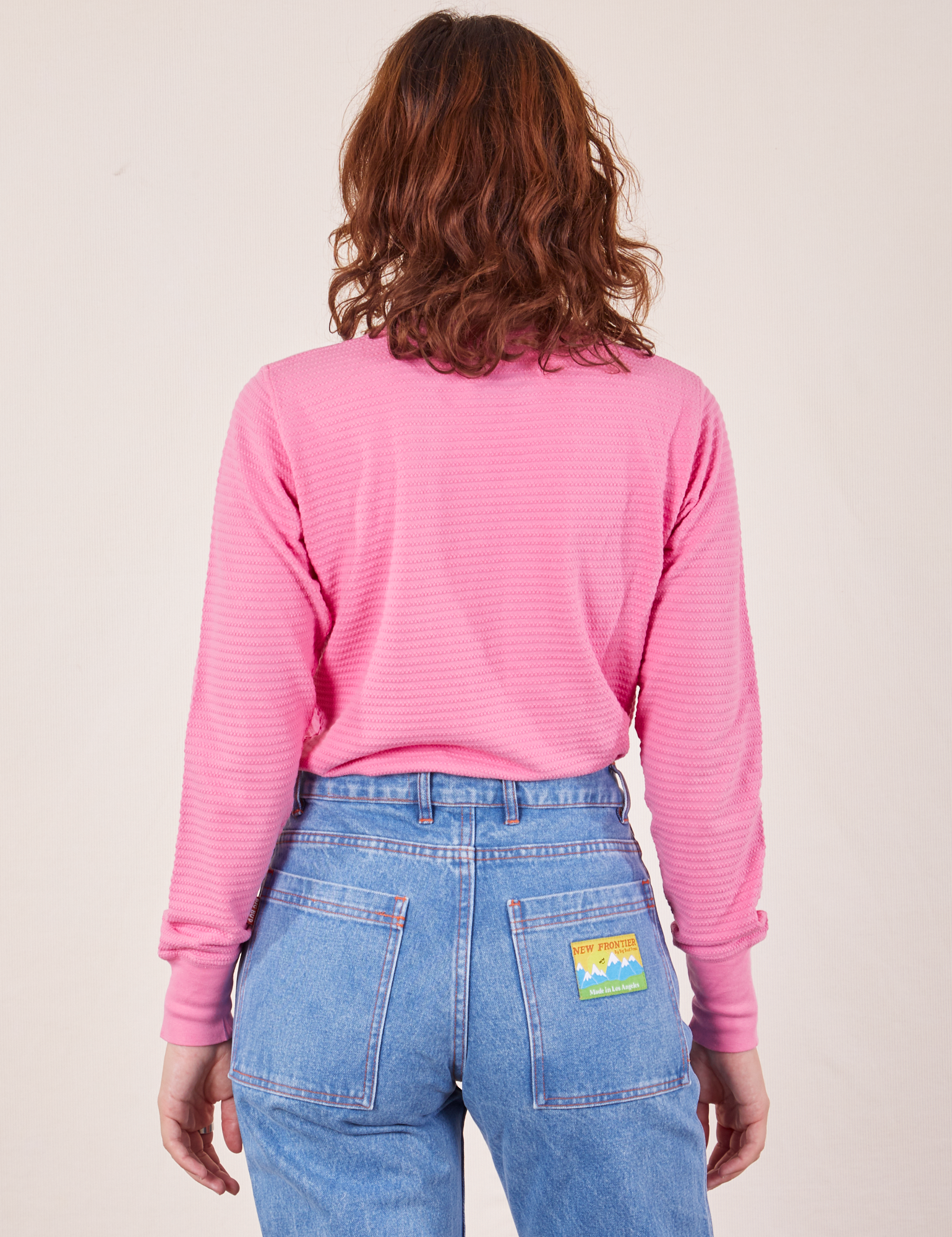 Back view of Honeycomb Thermal in Bubblegum Pink worn by Alex