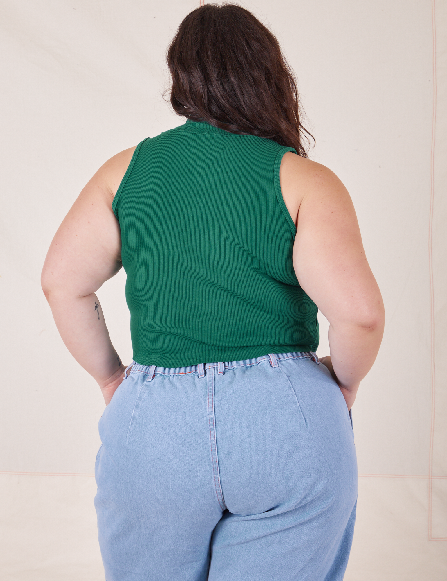 Back view of Sleeveless Essential Turtleneck in Hunter Green worn by Ashley