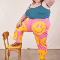 Catie is wearing Icon Work Pants in Smilies and marine blue Cropped Cami